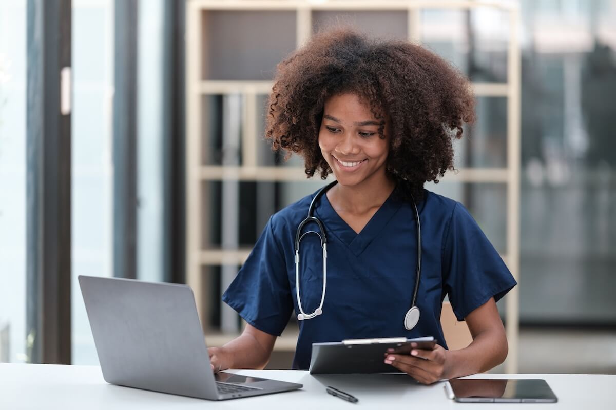 Portrait of female African American doctor with Stethoscope in her office at clinic.