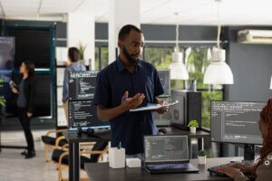 IT professional providing onsite technology support in a business office.