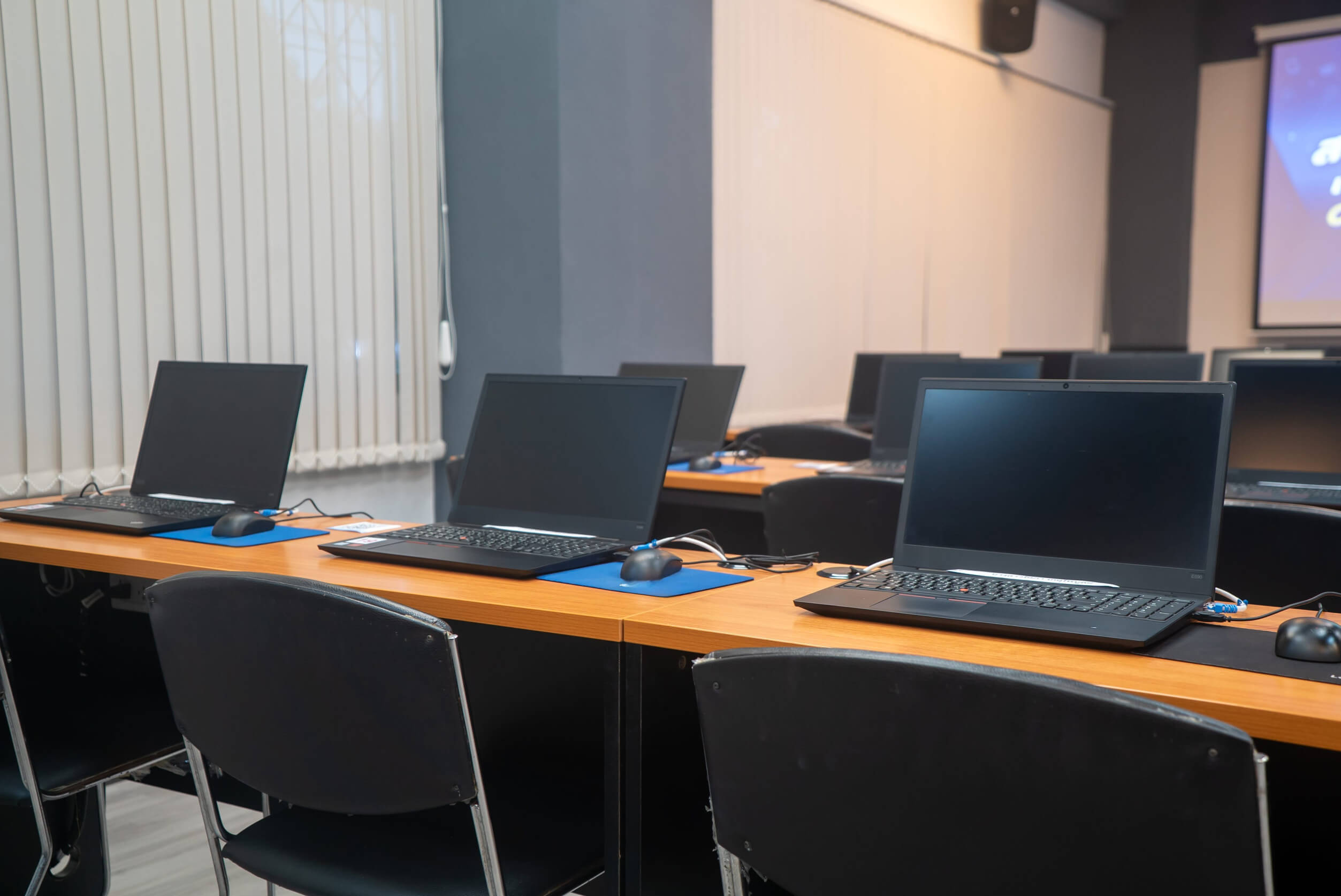 non-profit-computer-equipment-lifecycle Multiple laptop computers set up in a business workspace