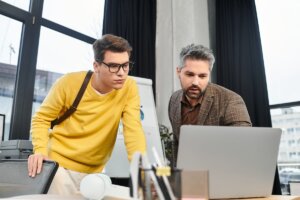 IT provider reviewing a computer system with an organization employee